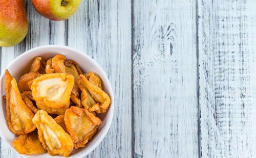 Bowl with dried Pears (close-up shot, selective focus)