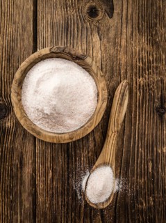 Pink Salt on a vintage background as detailed close-up shot (selective focus)