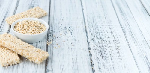 Some fresh made Quinoa Bars on vintage background (close-up shot)