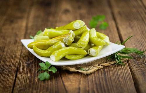 Some homemade Green Chilis (filled with cheese) (selective focus) as detailed close-up shot