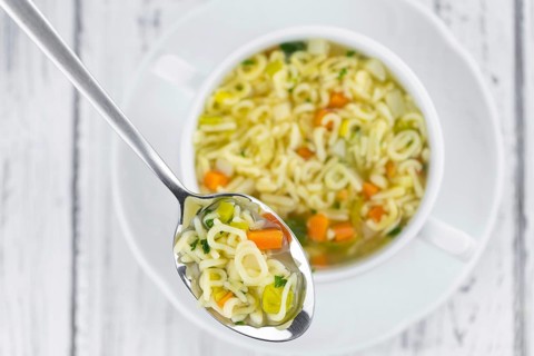 Portion of homemade Alphabet Soup (selective focus, close-up shot)