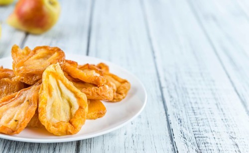 Some dried Pears (selective focus, close-up shot) on wooden background