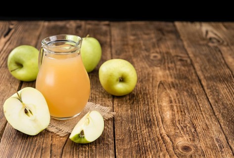 Fresh made Juice (apple) on a vintage background (close-up shot)