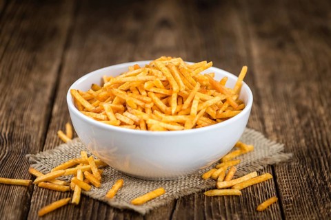 Portion of fried potato sticks (close-up shot, selective focus)