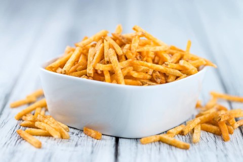 Portion of fried potato sticks (close-up shot, selective focus)