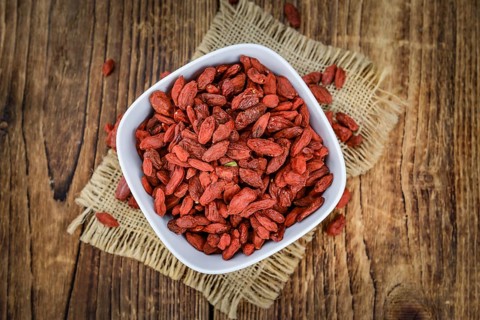 Goji Berries on a vintage background as detailed close-up shot (selective focus)