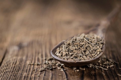 Heap of valerian roots (close-up shot) on vintage wooden background