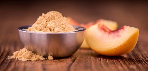 Ground Peaches on a vintage background as detailed close-up shot, selective focus