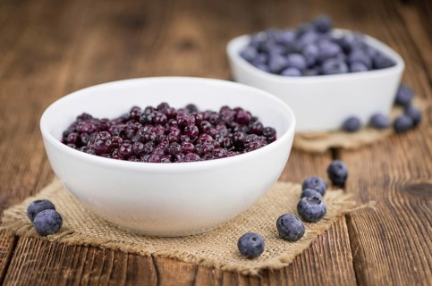 Fresh made Blueberries (preserved) on an old and rustic wooden table, selective focus, close-up