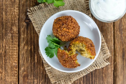 Wooden table with Falafels (close-up shot, selective focus)