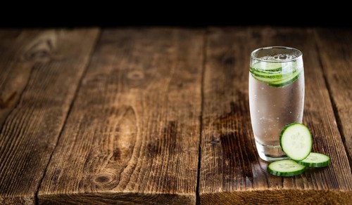Cucumber Water on a vintage background as detailed close-up shot, selective focus