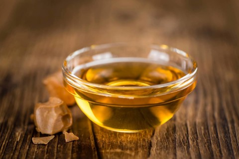Portion of fresh Caramel Sirup (close-up shot, selective focus)