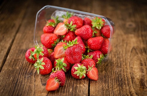 Strawberries on a vintage background as detailed close-up shot, selective focus