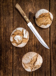 Wholemeal Roll on a vintage background as detailed close-up shot (selective focus)