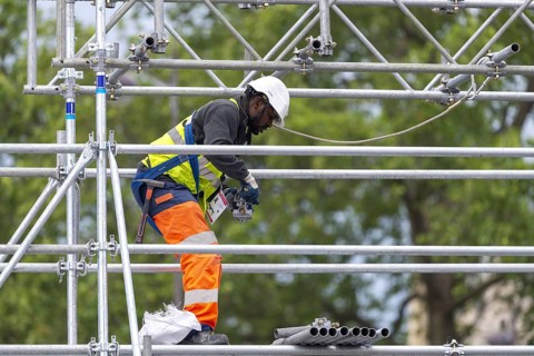 Scaffolders at work, erecting a large scaffold, grandstands for the Olympic Games, Place de la