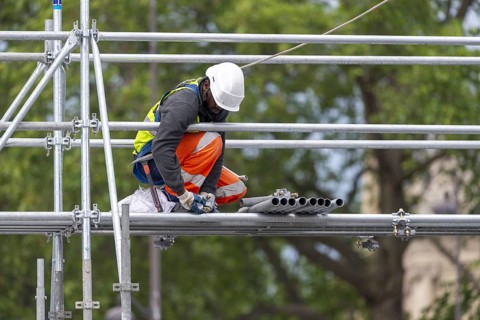 Scaffolders at work, erecting a large scaffold, grandstands for the Olympic Games, Place de la