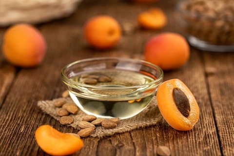Some Apricot Kernel Oil as detailed close up shot (selective focus)