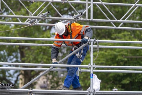 Scaffolders at work, erecting a large scaffold, grandstands for the Olympic Games, Place de la
