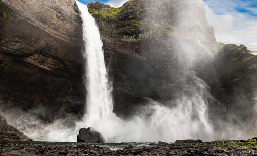 Haifoss waterfall in western Iceland at a cloudy summer day