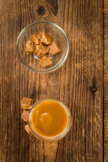 Portion of fresh Caramel Sauce (close-up shot, selective focus)