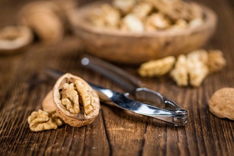 Portion of fresh Walnut kernels (close-up shot, selective focus)