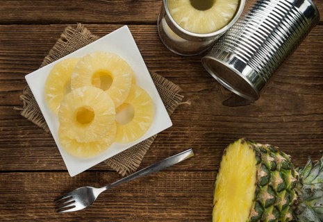 Preserved Pineapple Rings on a vintage background as detailed close-up shot, selective focus