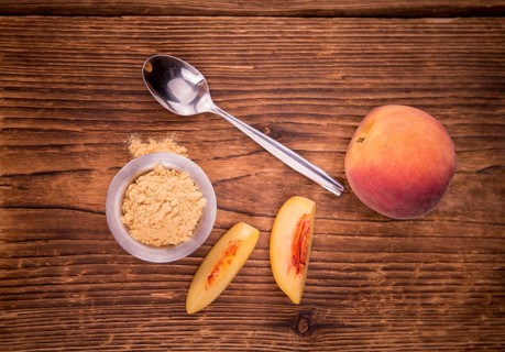 Ground Peaches on a vintage background as detailed close-up shot, selective focus