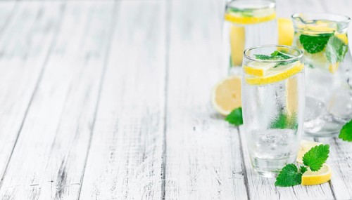 Lemonade on a vintage background as detailed close-up shot (selective focus)