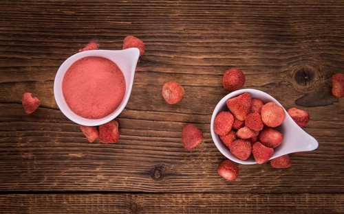 Fresh made Strawberry powder on an old and rustic wooden table, selective focus, close-up shot