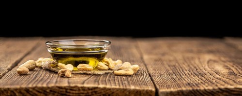 Portion of Cashew Oil (detailed close up shot, selective focus)