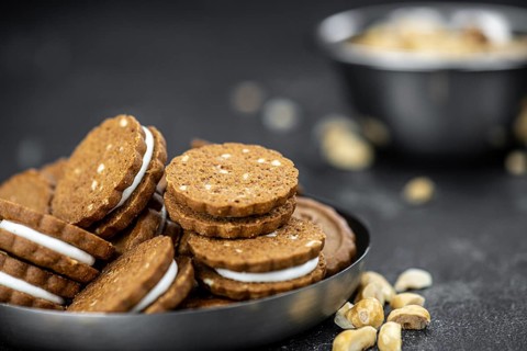 Portion of fresh made Hazelnut Cream Cookies as detailed close up shot (selective focus)