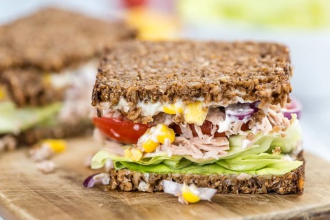 Tuna Sandwich (wholemeal bread, selective focus) on an old wooden table