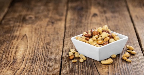 Portion of roasted nuts as detailed close up shot (selective focus)