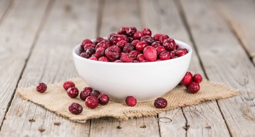 Portion of healthy Dried Cranberries (selective focus, close-up shot)