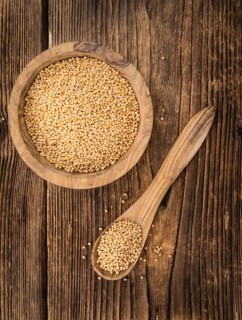 Seeds (Mustard) as high detailed close-up shot on a vintage wooden table (selective focus)