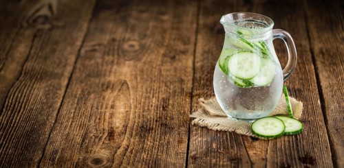 Cucumber Water on a vintage background as detailed close-up shot, selective focus