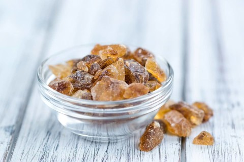 Portion of brown Rock Candy as detailed close-up shot (selective focus)