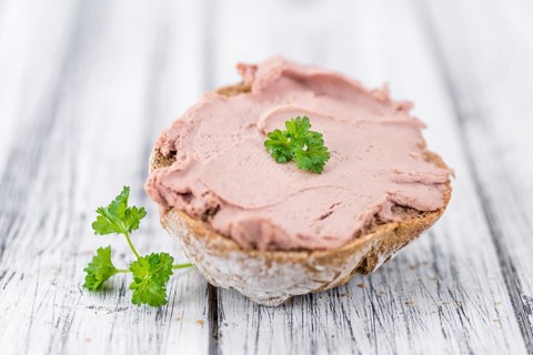Liverwurst Sandwich on a vintage background as detailed close-up shot (selective focus)