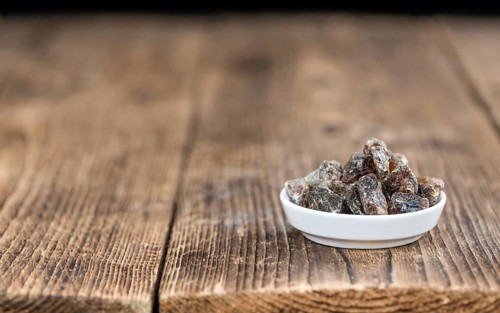 Portion of brown Rock Candy as detailed close-up shot (selective focus)