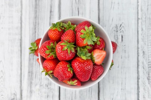 Strawberries on a vintage background as detailed close-up shot, selective focus