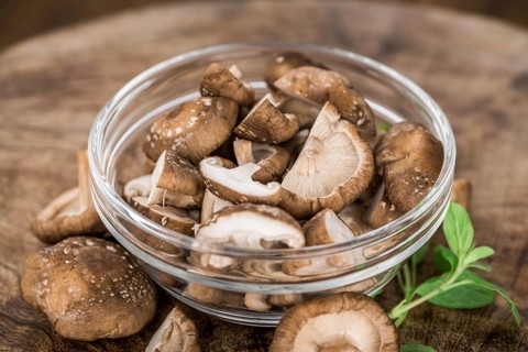 Portion of fresh Shiitake mushrooms close-up shot, selective focus