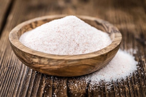 Pink Salt on a vintage background as detailed close-up shot (selective focus)