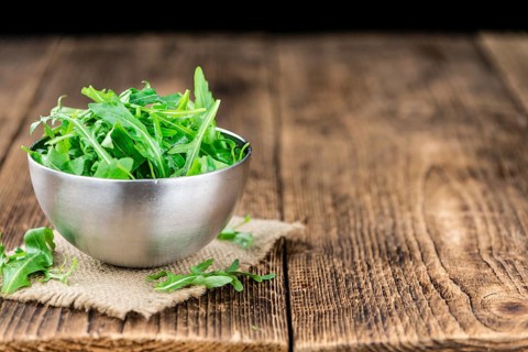 Portion of fresh Arugula (detailed close-up shot, selective focus)