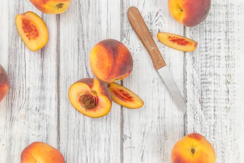 Portion of fresh Peaches close-up shot, selective focus