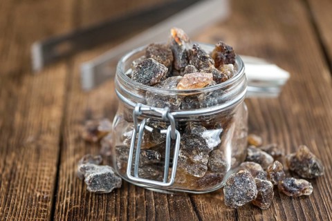 Portion of brown Rock Candy as detailed close-up shot (selective focus)