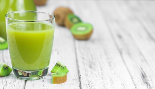 Fresh made Kiwi Smoothie (selective focus) on a vintage looking background