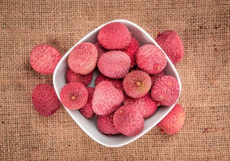 Portion of fresh Lychees (close-up shot, selective focus)