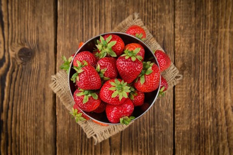 Strawberries on a vintage background as detailed close-up shot, selective focus