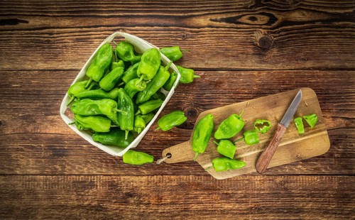 Raw Pimientos on a vintage background as detailed close-up shot, selective focus
