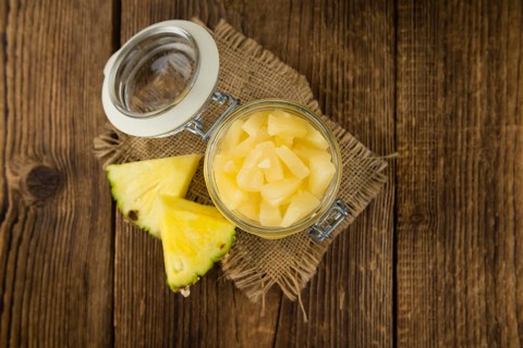 Portion of fresh Preserved Pineapple pieces close-up shot, selective focus